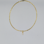 Nacre Bangle by Nudie – studio photo on white background showing the bangle hanging front-on to the camera, highlighting its sculpted shape and pearl detail.
