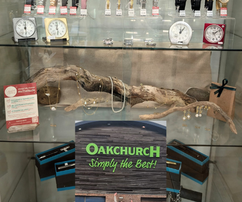 Collage of a store display with jewelry and clocks, and a person standing in front of 'Oakchurch' signage.
